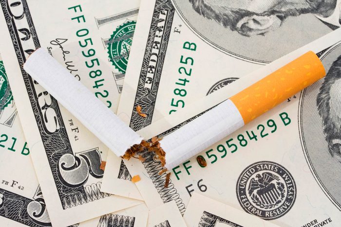 cigarette on money