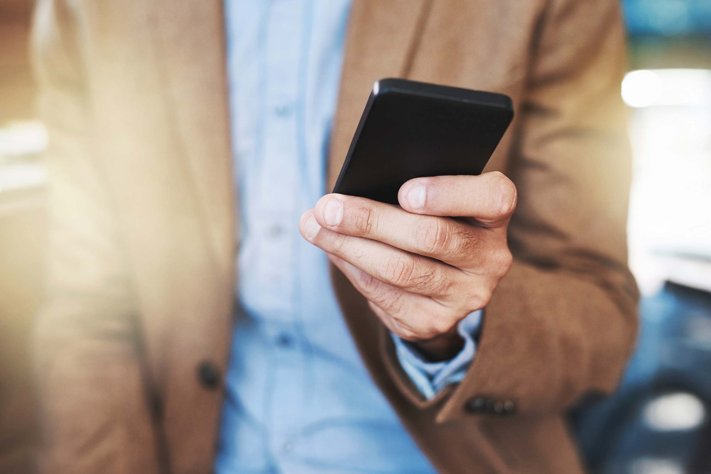 man holding cell phone