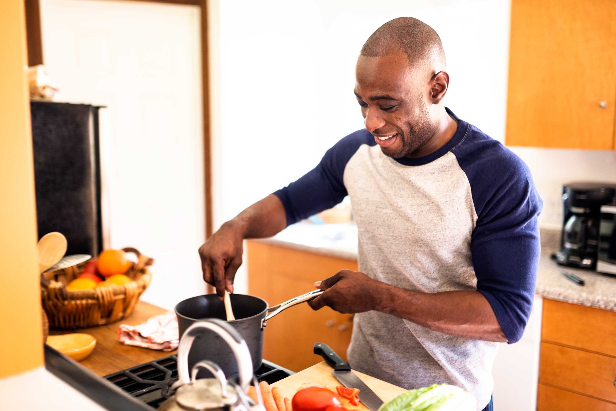 man cooking on stovetop
