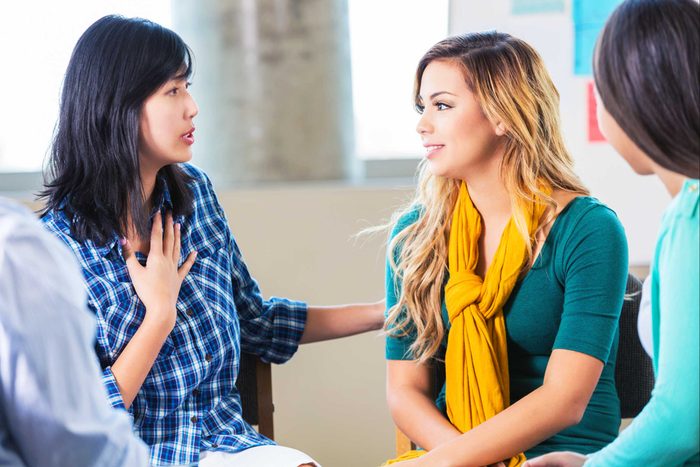 three woman talking to each other