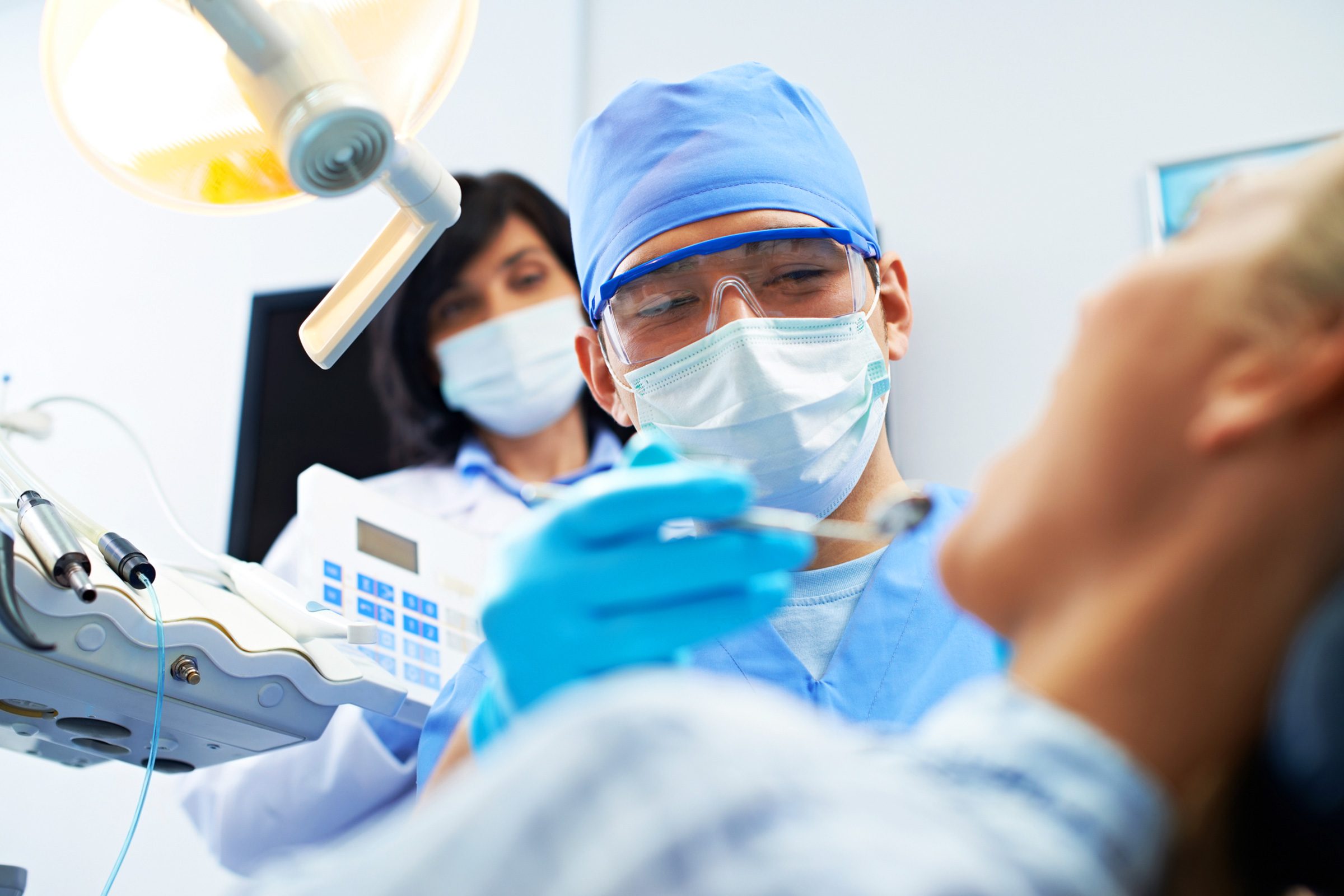 dentist examining patient's mouth