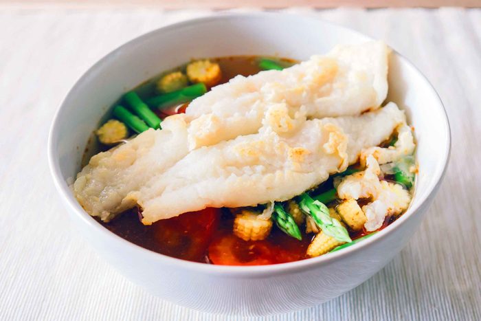 filet of white fish on top of vegetables