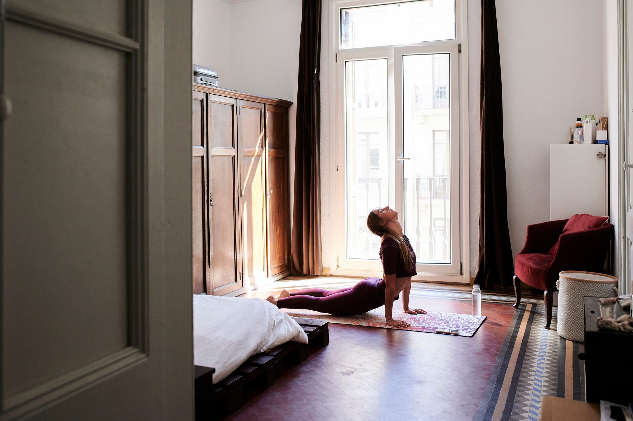 woman doing yoga at home