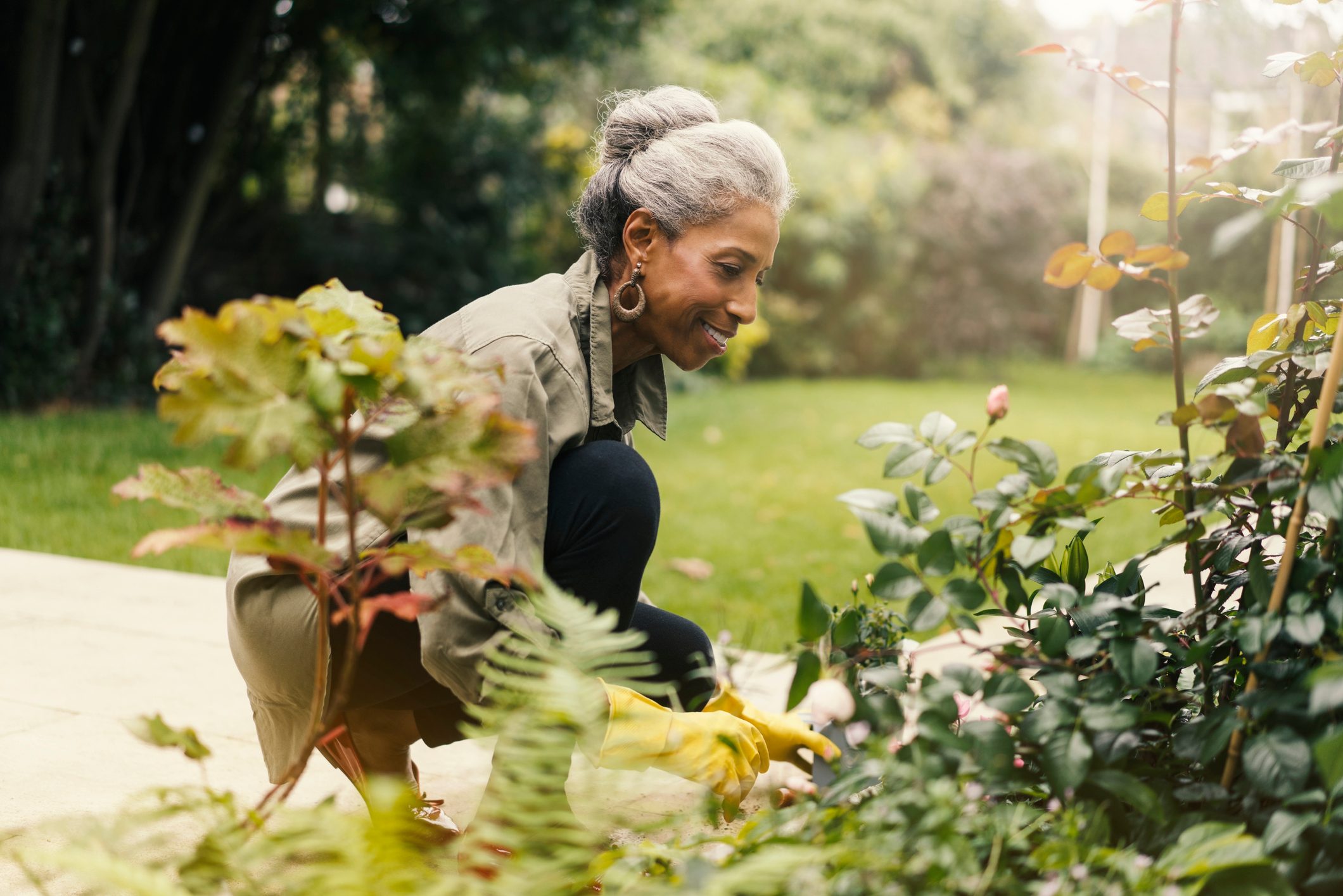 woman doing yard work and gardening at home