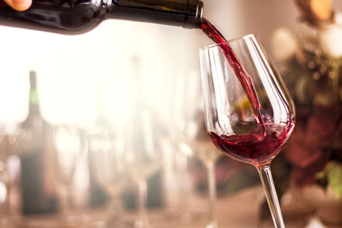 pouring a glass of red wine