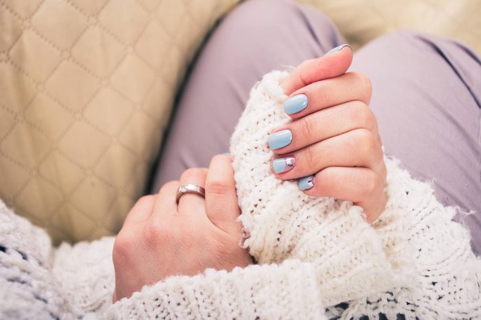 woman's hands with nails painted