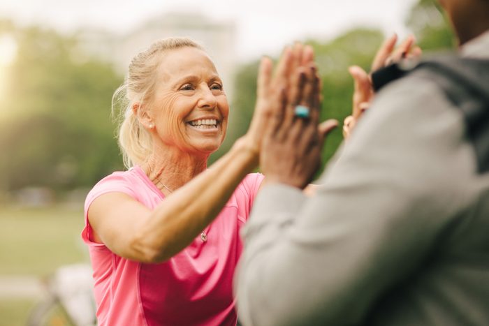 senior couple high five after exercise