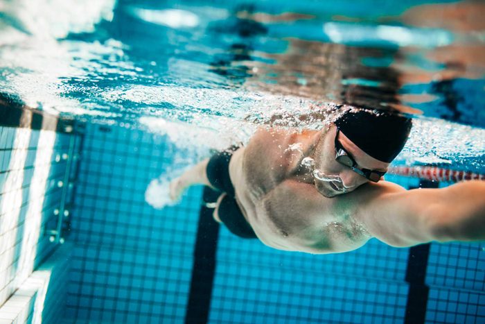 male swimmer doing the crawl stroke in pool
