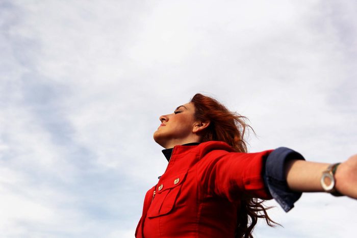 woman with arms outstretched