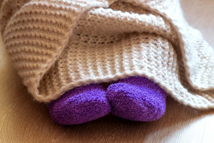 feet under blanket
