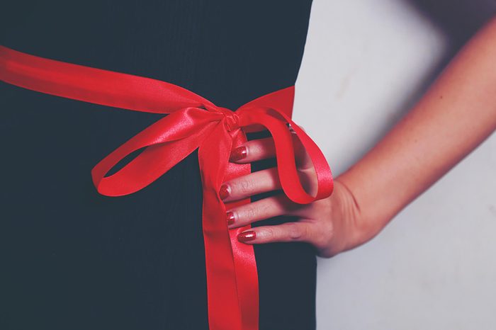 woman with ribbon around waist