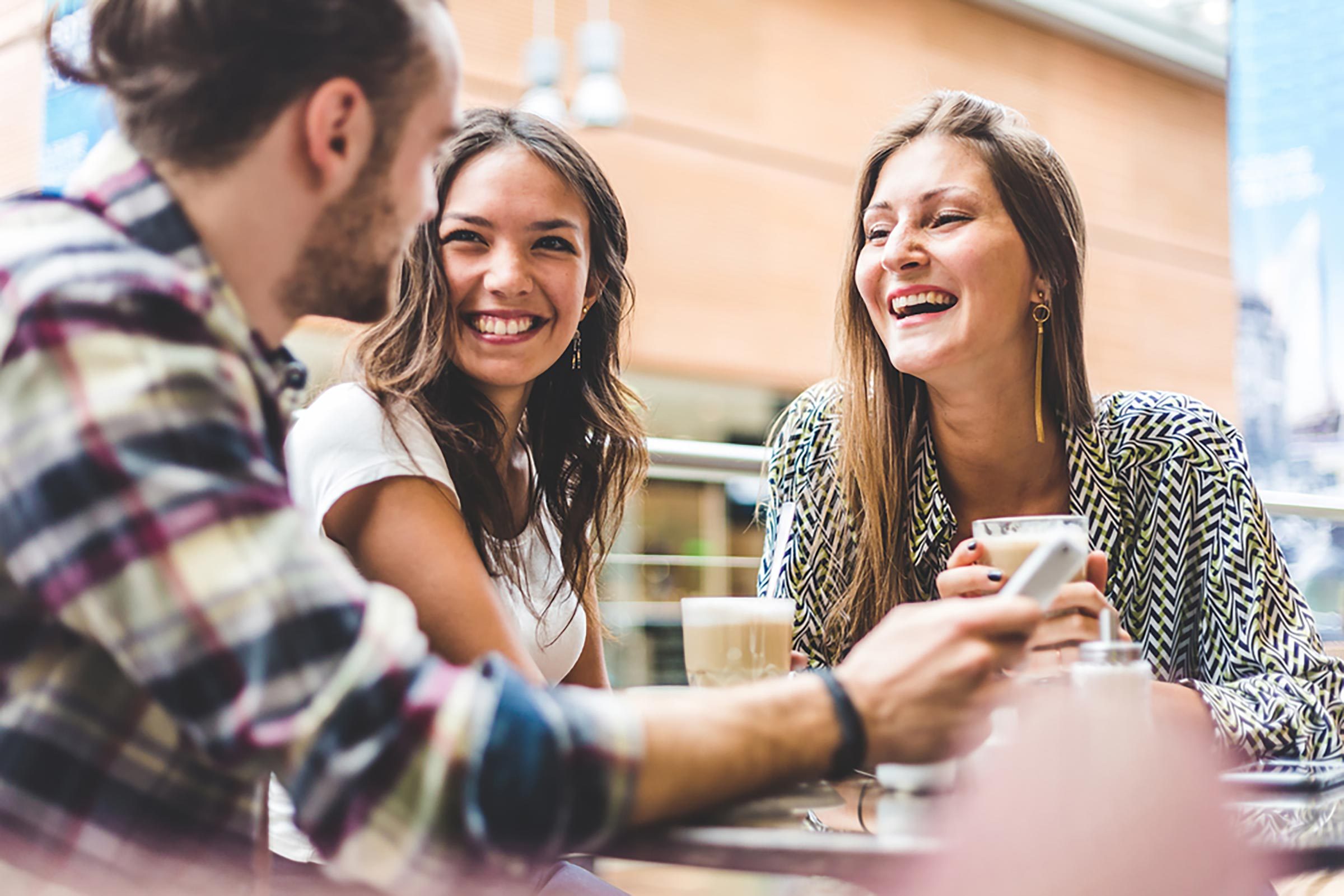 three friends smiling and talking