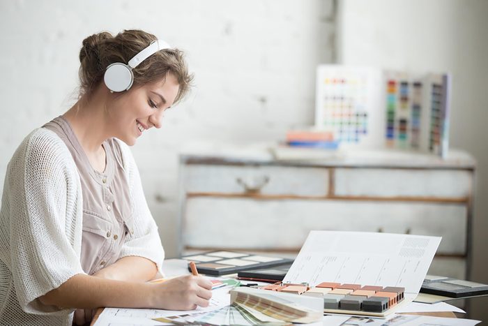 woman listening music on headphones