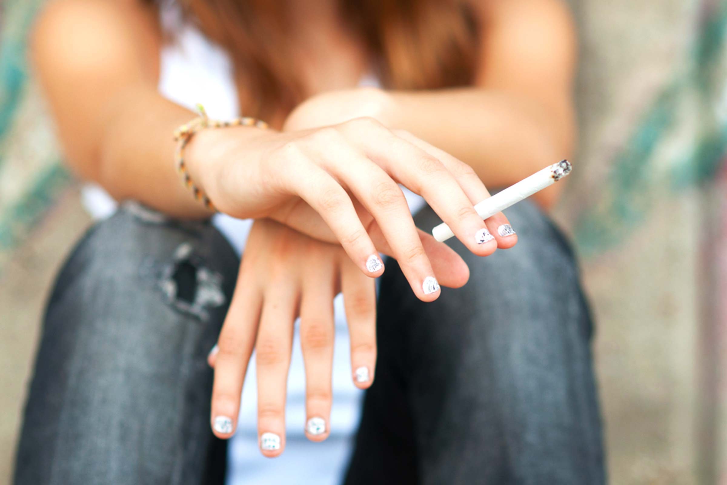 Woman holding a cigarette