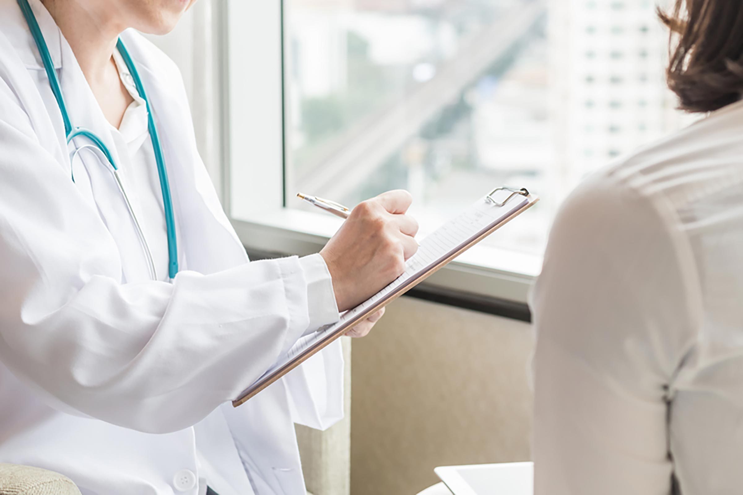 doctor meeting with female patient