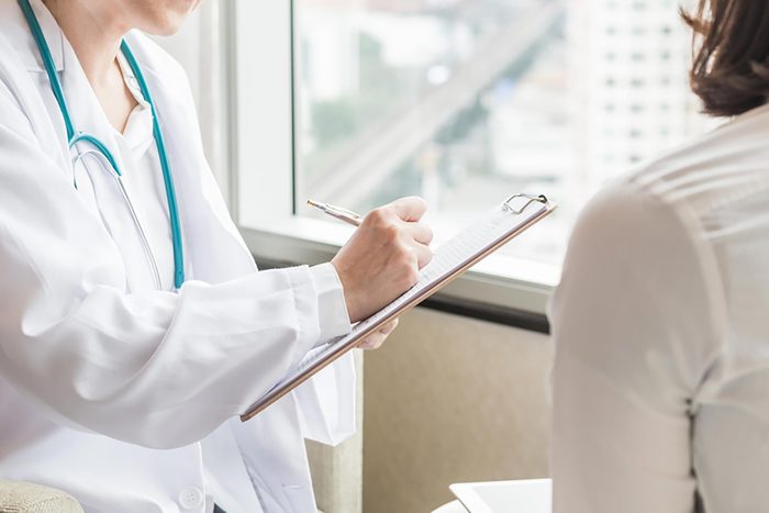 doctor meeting with female patient