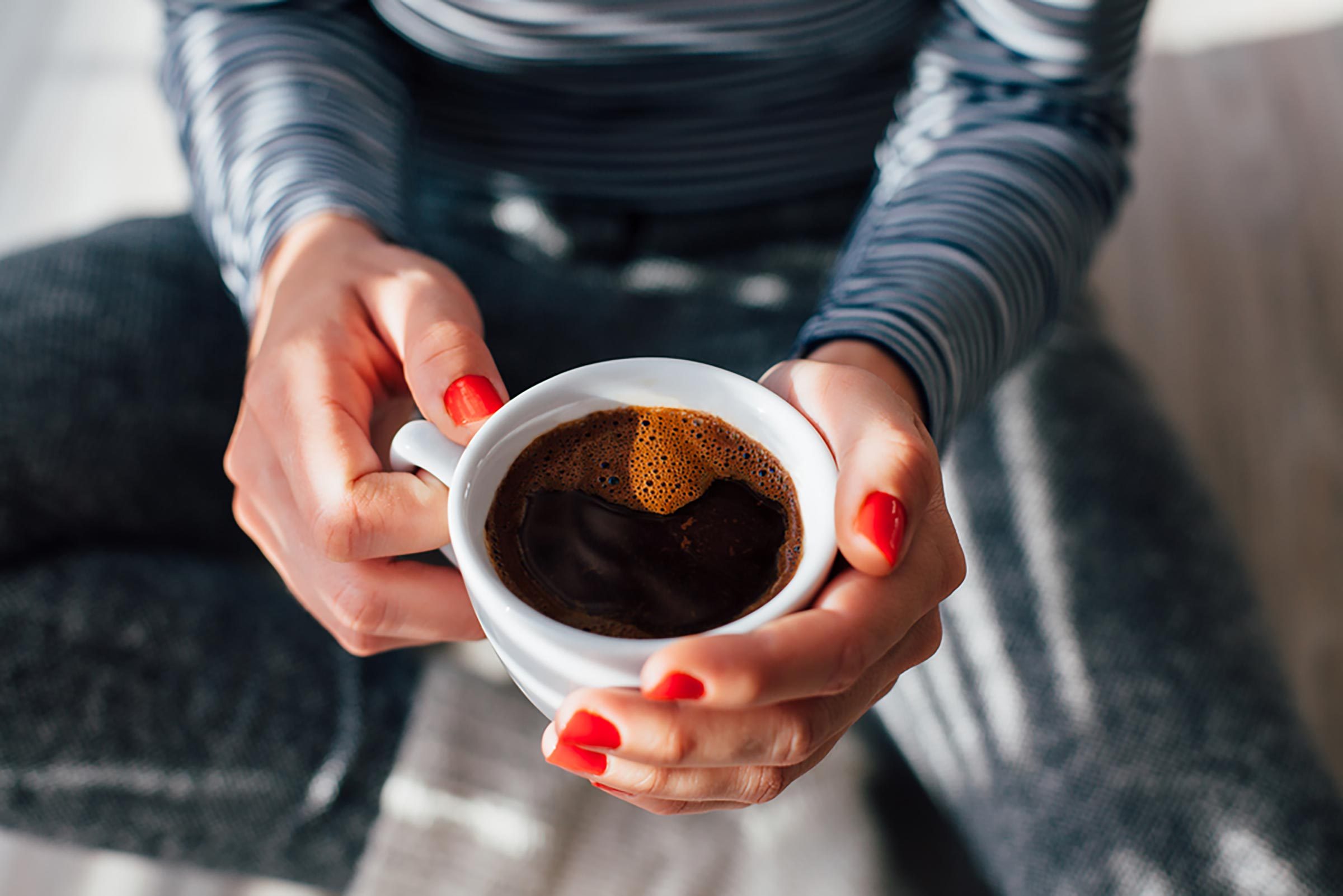 woman holding coffee