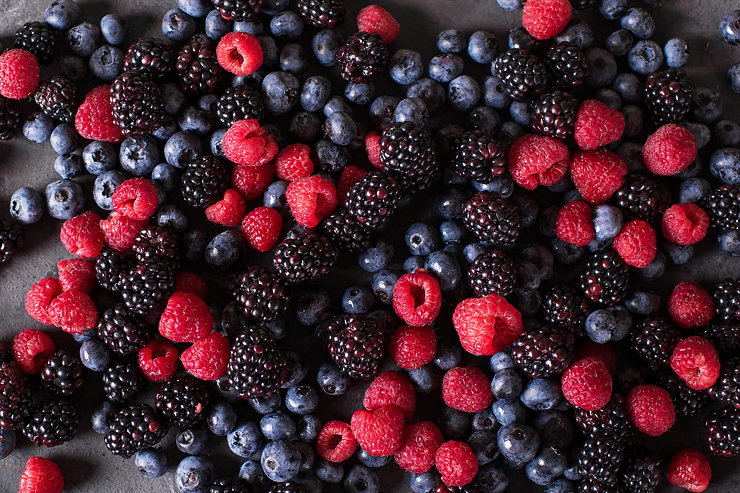 close up of mixed blueberries, raspberries and blackberries