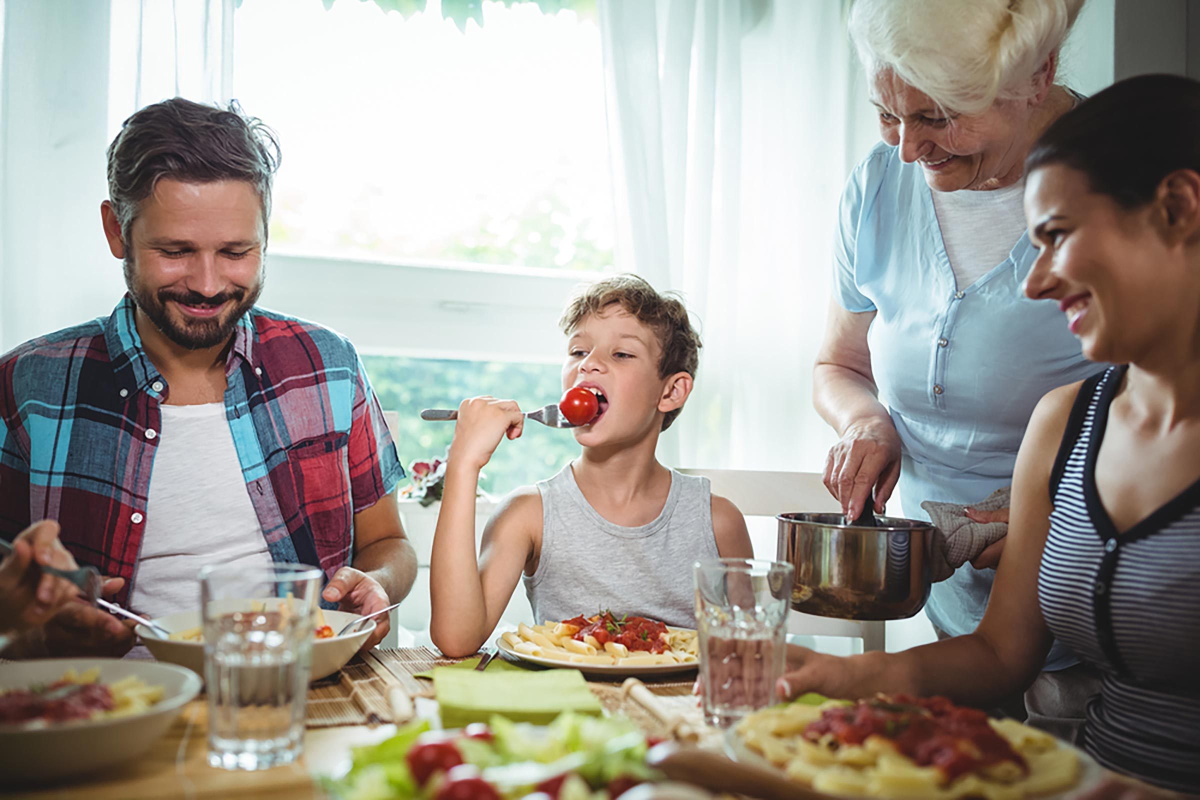 family sitting around dinner table