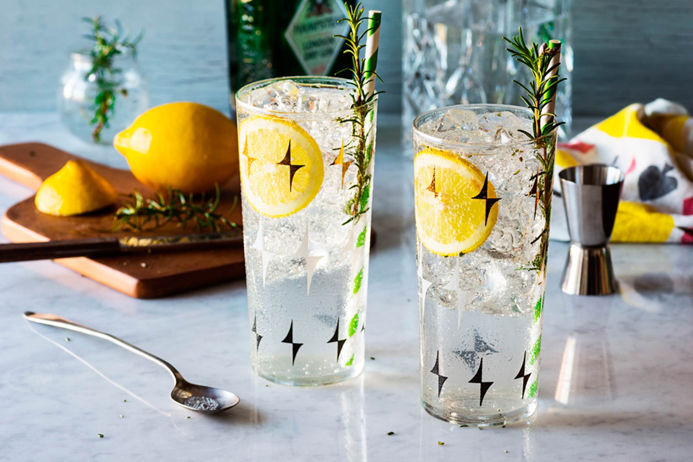 Two glasses of seltzer with lemon.