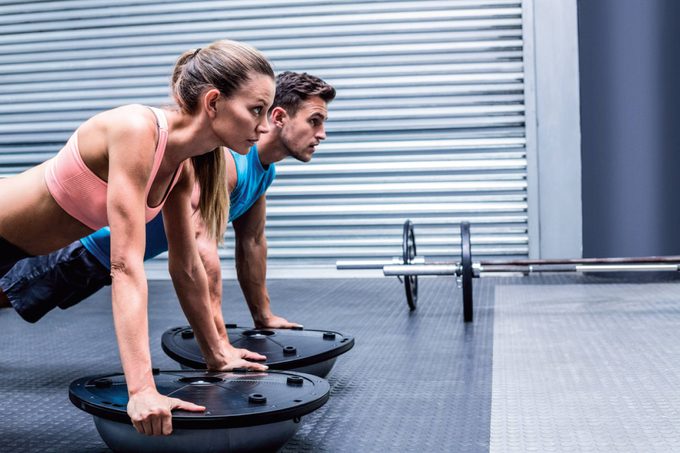 Man and woman working out together.