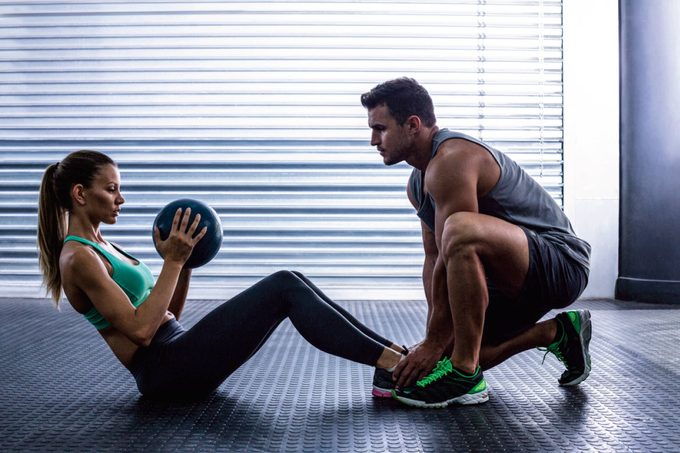 Man and woman working out together.