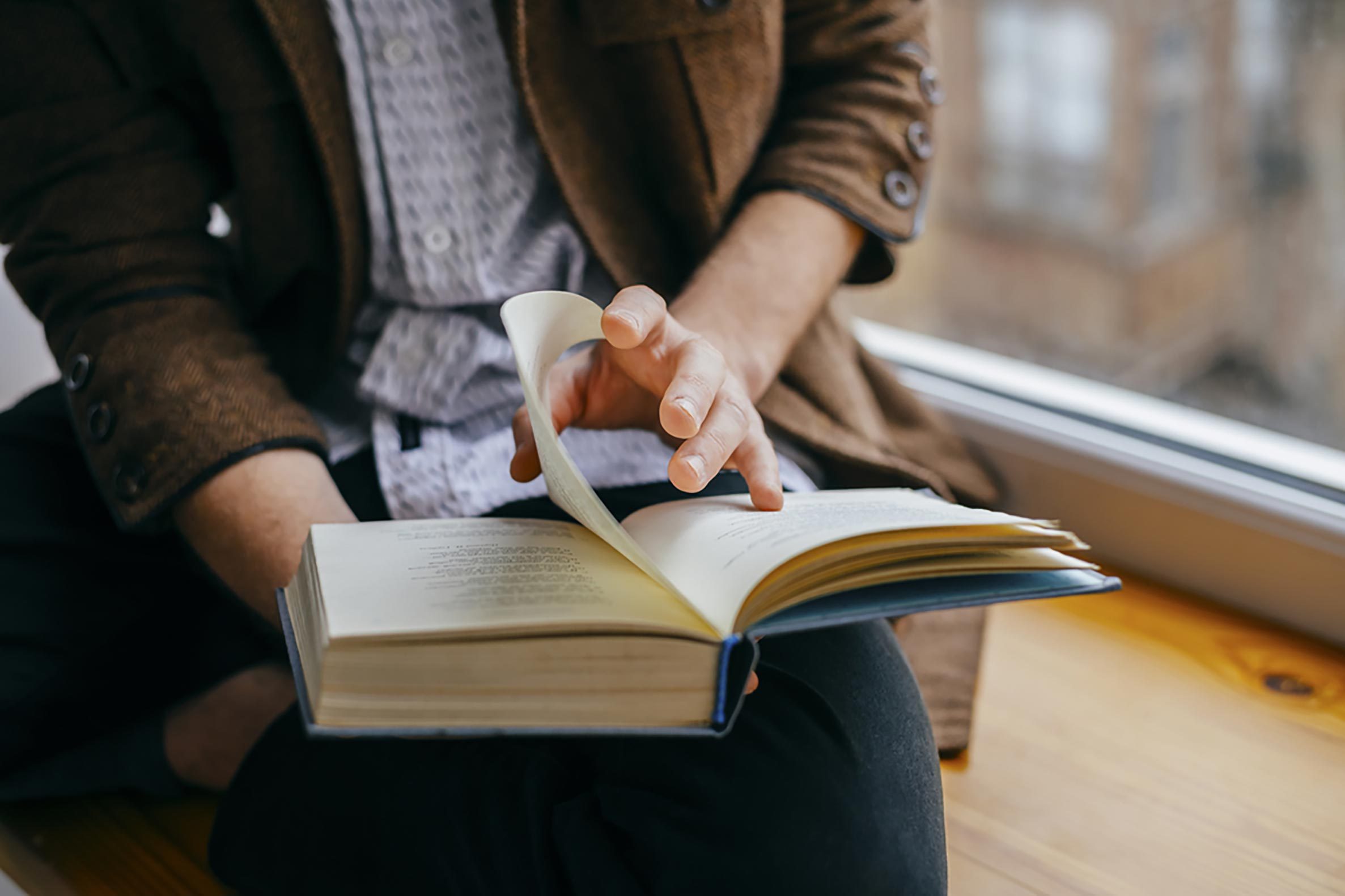 man with open book