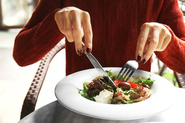 woman eating a salad