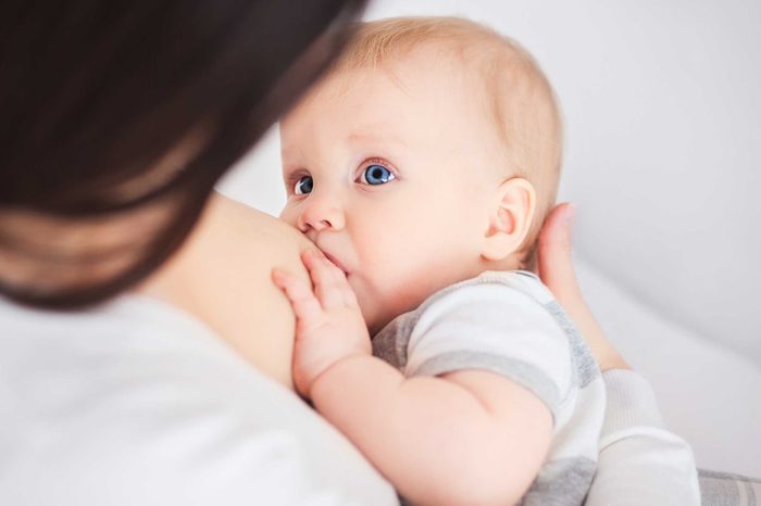 Baby at mom's breast.