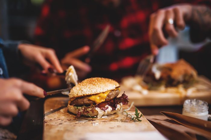 people eating burgers