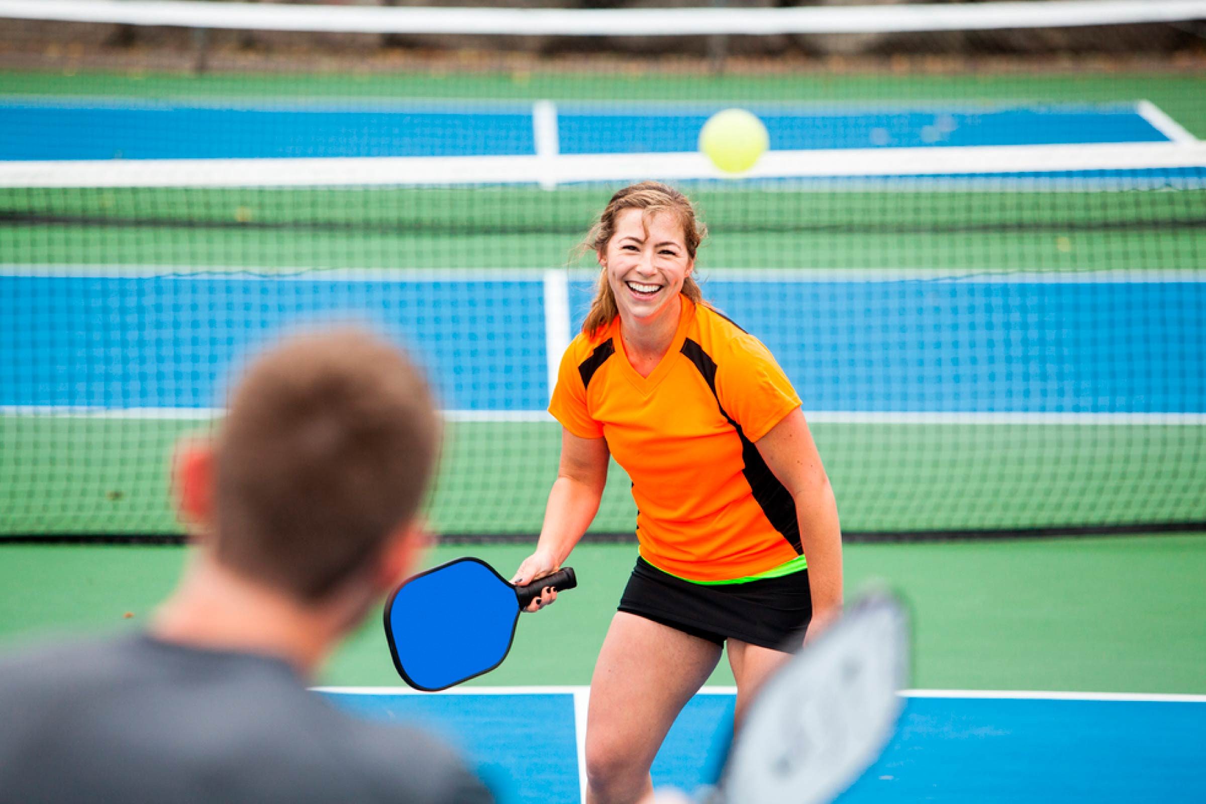 Couple playing pickleball