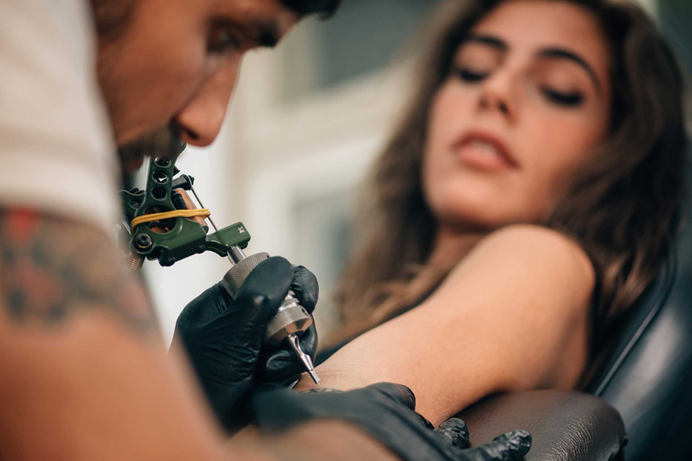 woman getting a tattoo