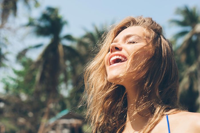 woman in the sun, smiling