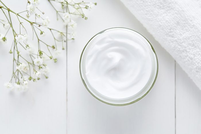 A tub of lotion or moisturizer