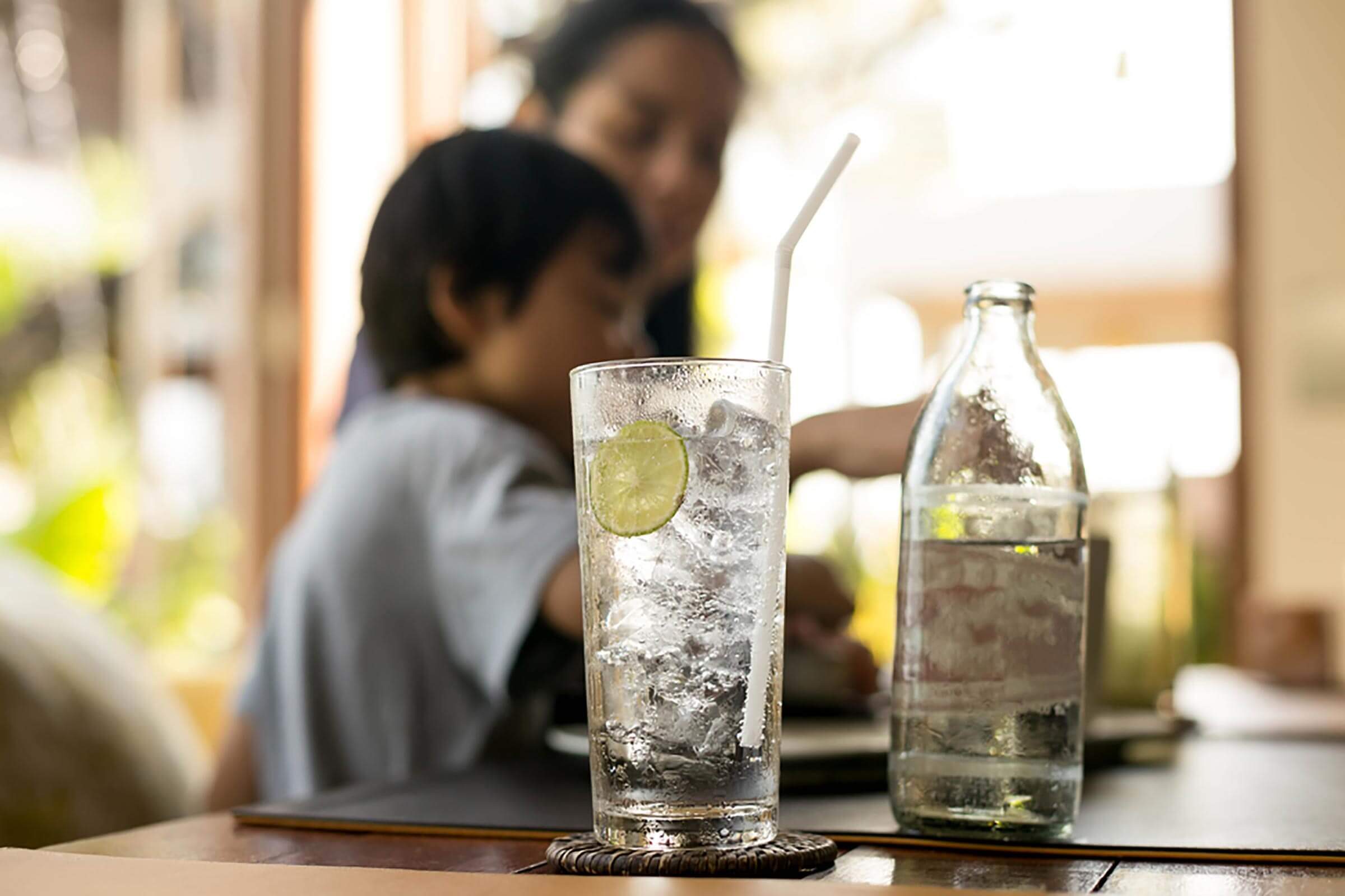 glass of water sitting on a table