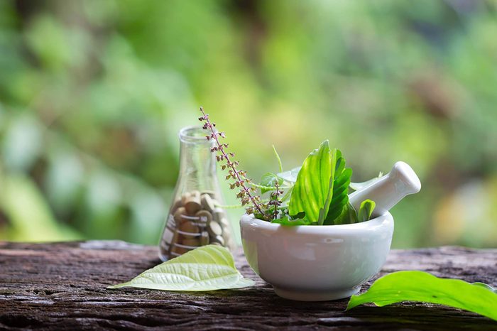 Mortar and pestle on log