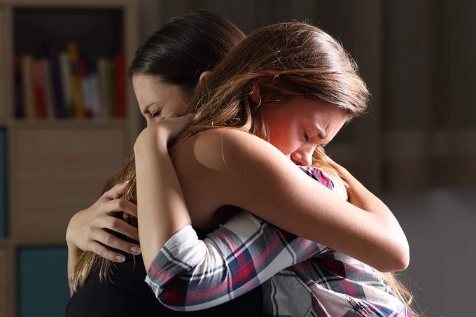 two women consoling