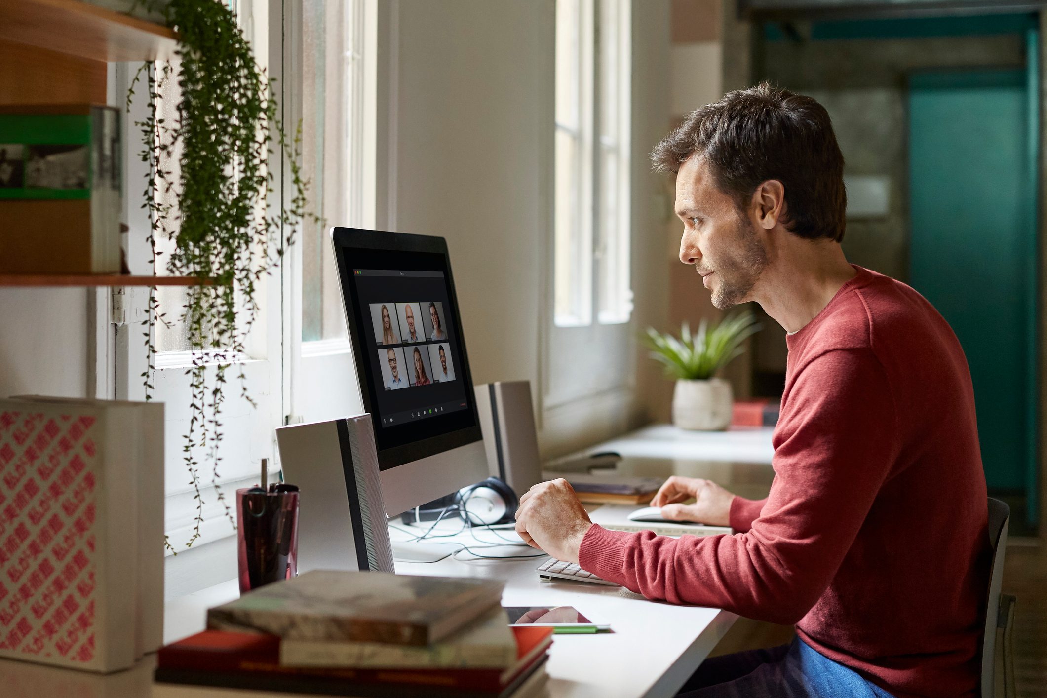 man in a virtual meeting working from home