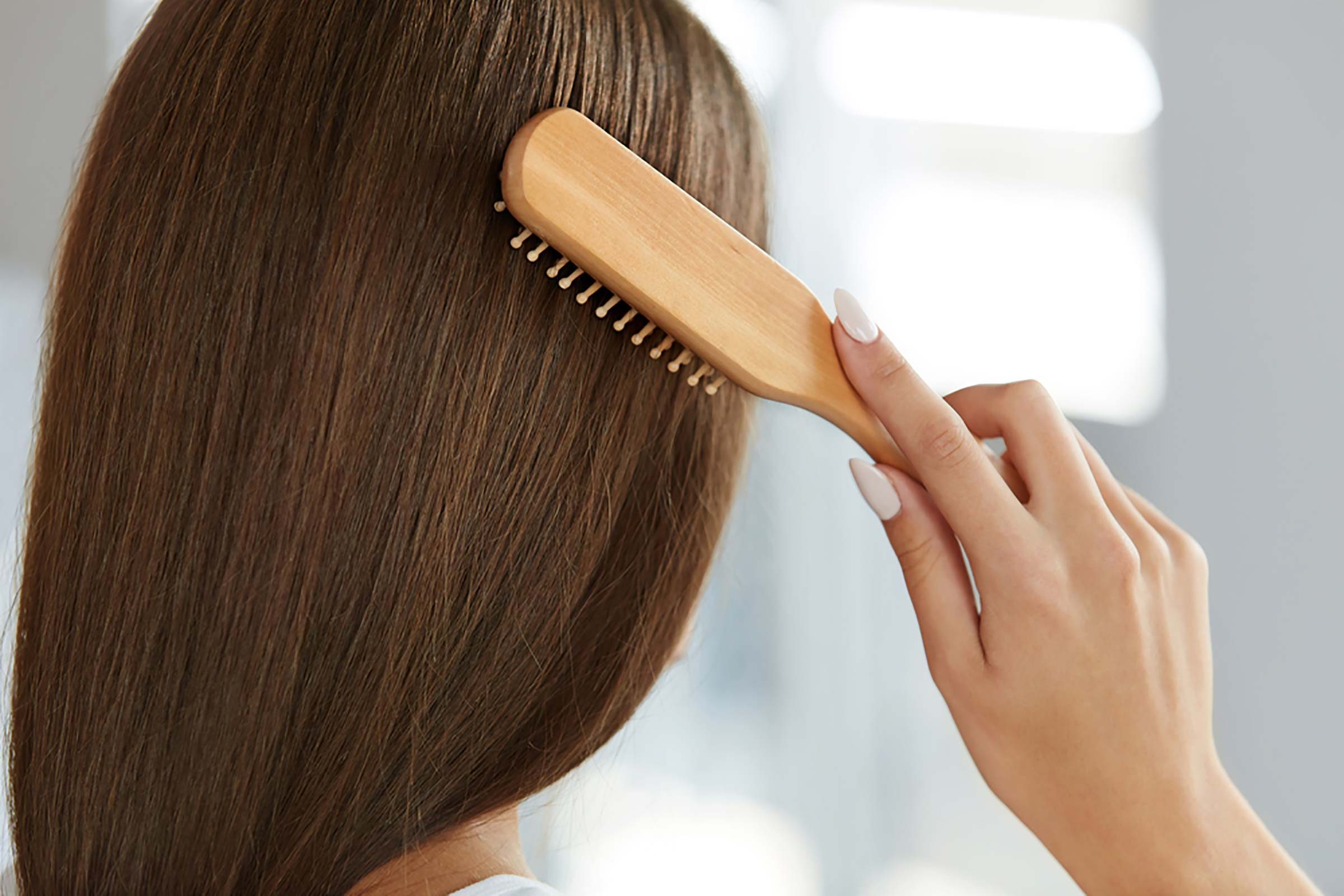 woman brushing her hair