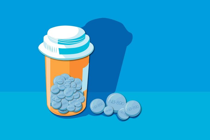 Illustration of a pill bottle and pills.