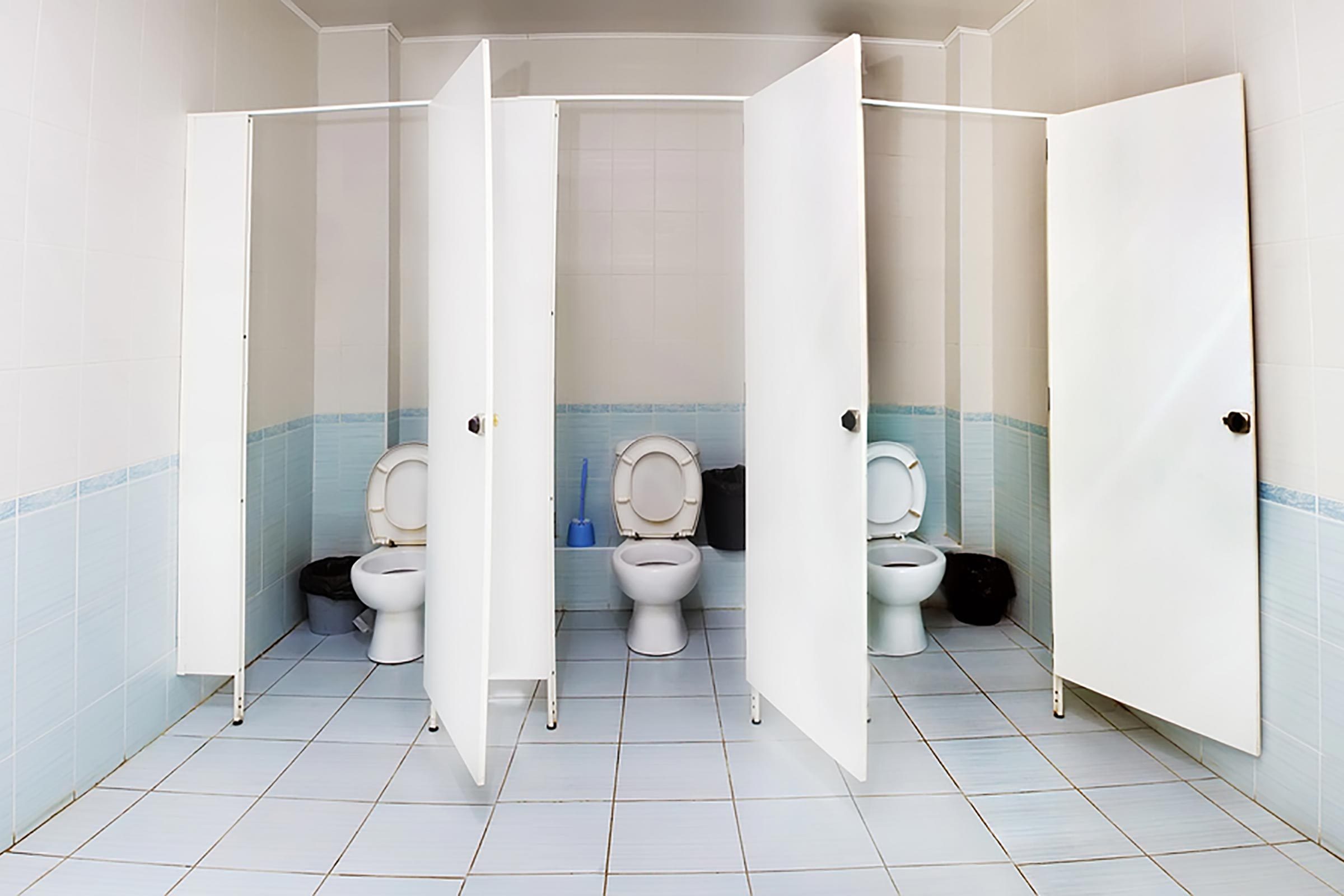 three empty stalls in a bathroom