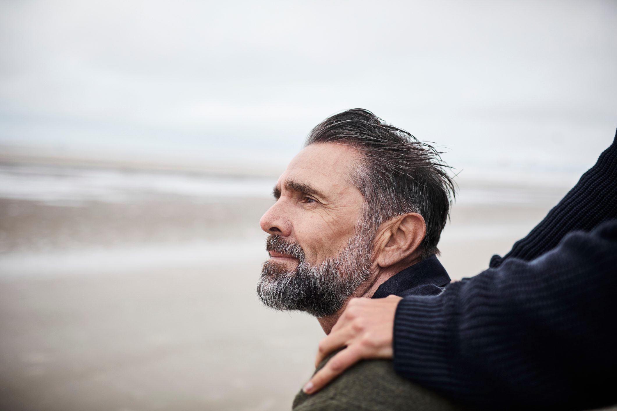 man sitting on the beach