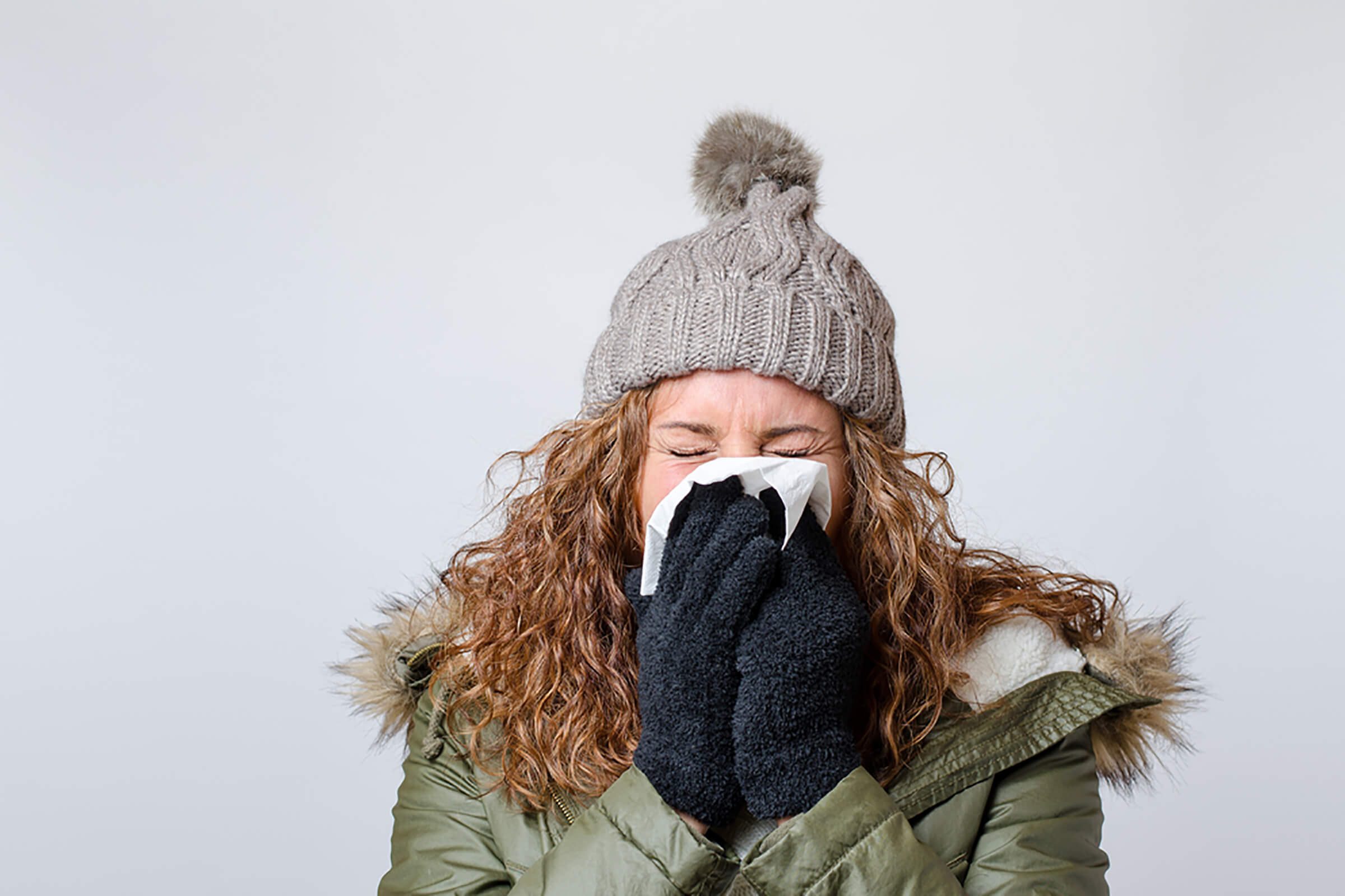 woman-blowing-her-nose