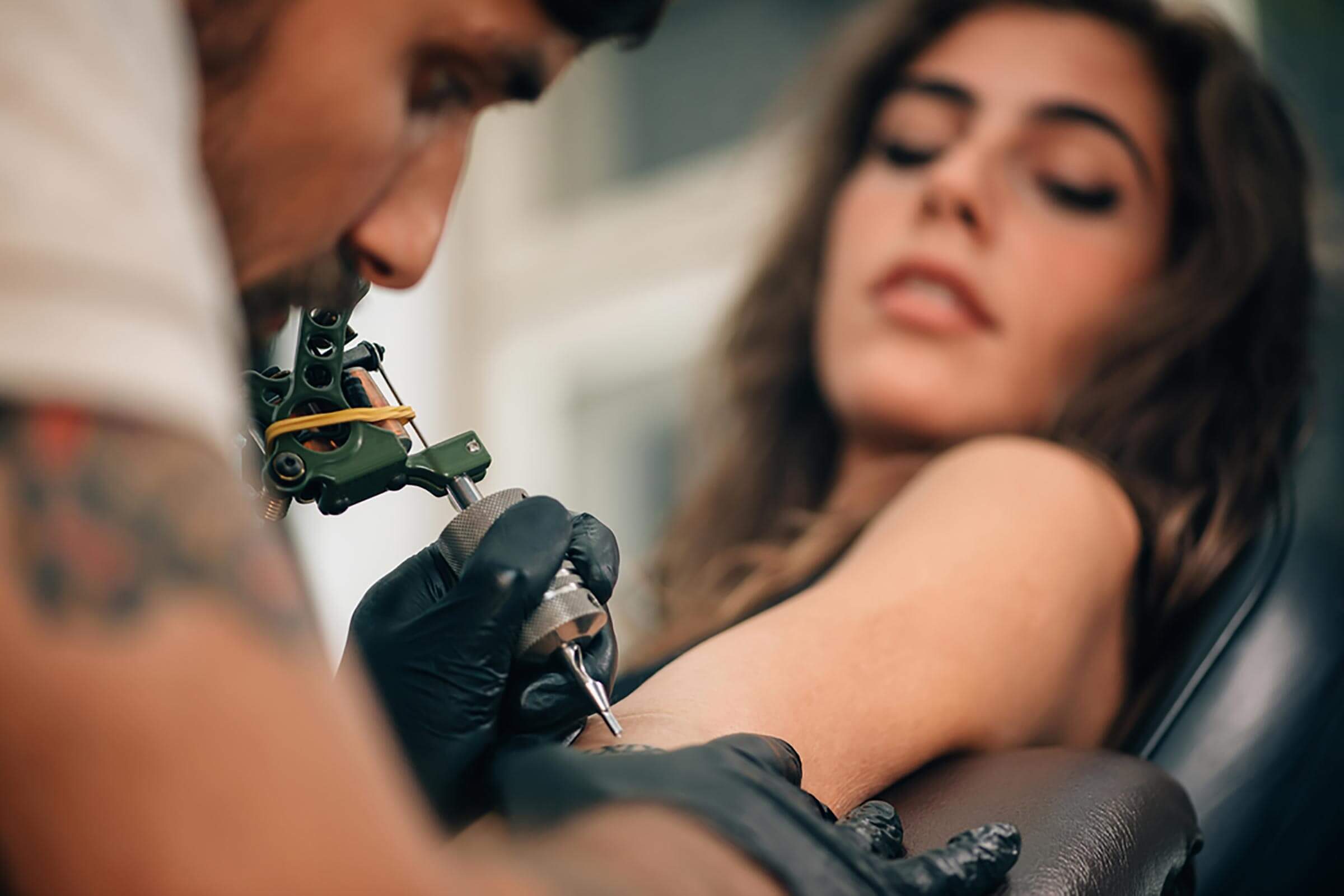 woman getting a tattoo