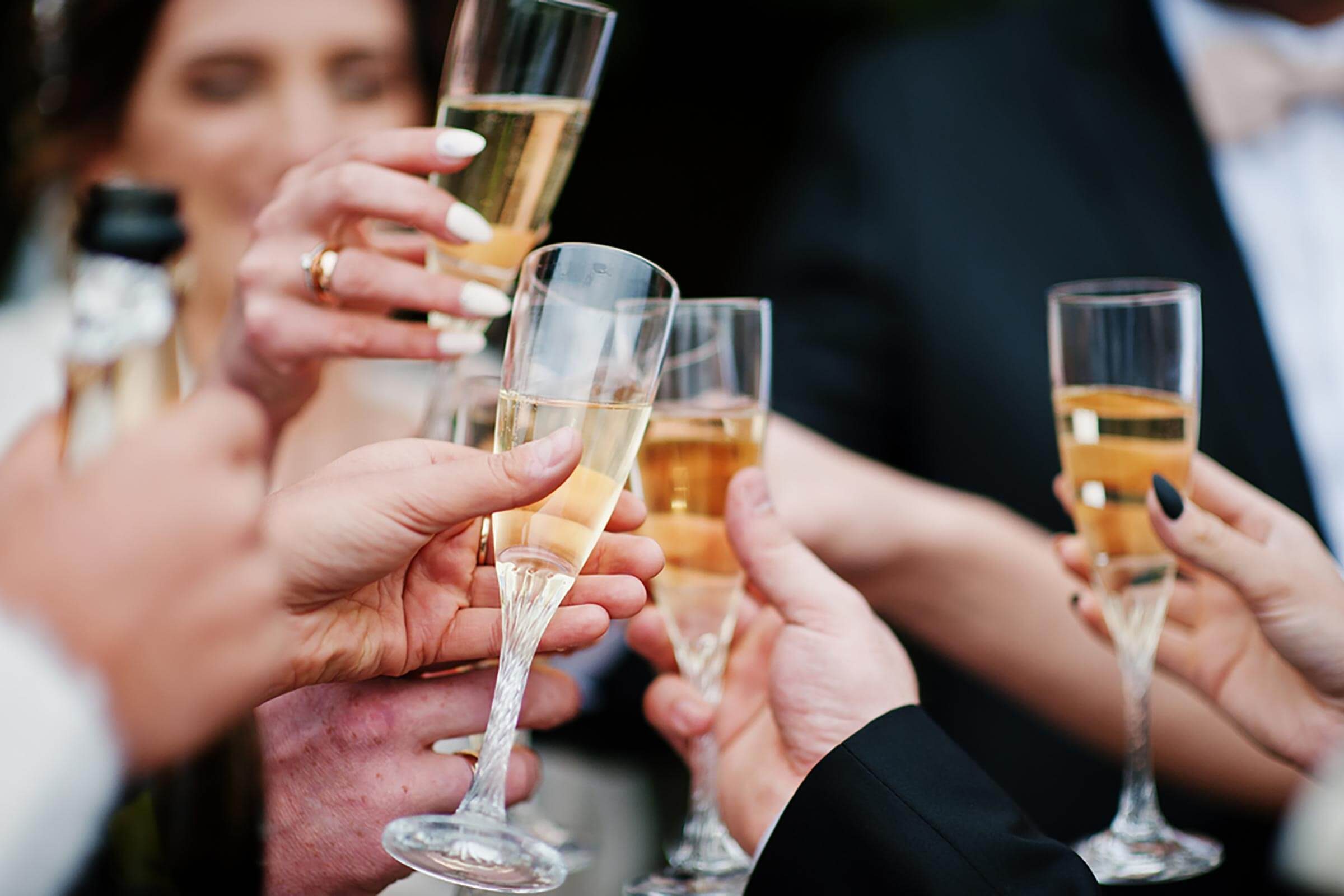 people toasting with glasses of champagne