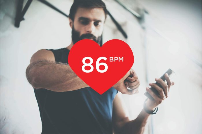 man checking fitness tracker