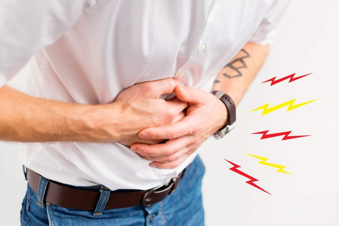 man clutching his stomach