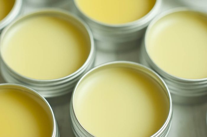 natural lip balms from beeswax in tin pots