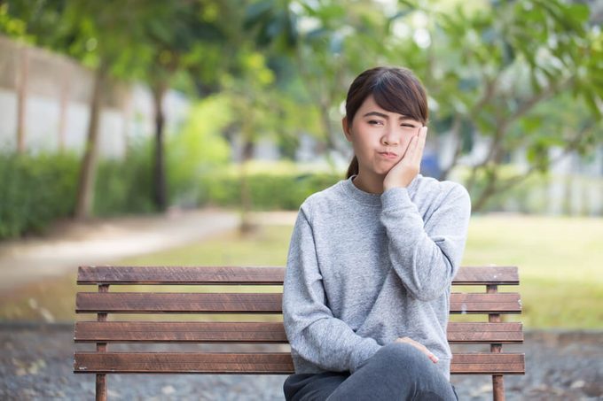 Woman has toothache coppy space