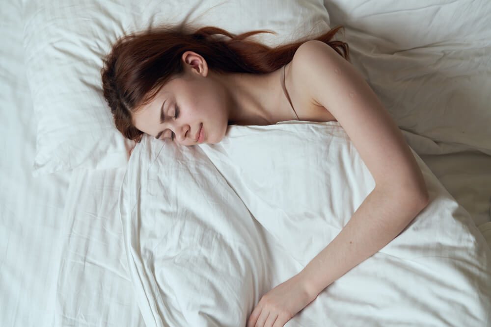 Woman sleeping in bed 